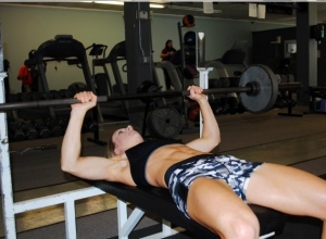 Randi Lackey working on bench press.