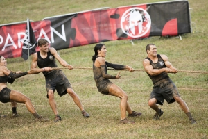 SPARTAN: ULTIMATE TEAM CHALLENGE -- Episode 101 -- Pictured: (l-r) Maggie Thorne, Spencer Mahoney, Monica Gillmore, Lance Pekus of "Team GRIT" on the Herc Hoist -- (Photo by: Mark Hill/NBC)